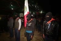 1 de enero del 2015. San Andrés Larrainzar. La delegación de padres de familia y compañeros de los normalistas de Ayotzinapa durante las celebraciones del aniversario zapatista en el Caracol II de Oventik