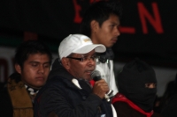 1 de enero del 2015. San Andrés Larrainzar. La delegación de padres de familia y compañeros de los normalistas de Ayotzinapa durante las celebraciones del aniversario zapatista en el Caracol II de Oventik