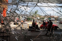 Viernes 15 de marzo del 2019. Tuxtla Gutiérrez. Negocios con destrozos y autos vandalizados después del operativo de desalojo del predio invadido en el libramiento norte