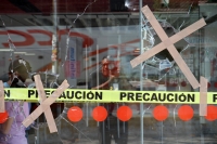 Viernes 15 de marzo del 2019. Tuxtla Guti�rrez. Negocios con destrozos y autos vandalizados despu�s del operativo de desalojo del predio invadido en el libramiento norte
